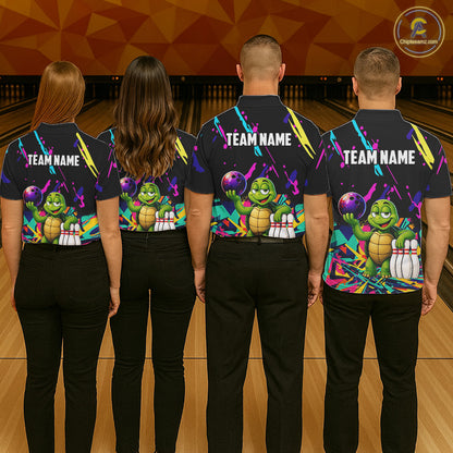 Four people wearing matching shirts with a turtle graphic and 'TEAM NAME' text on a bowling alley background.