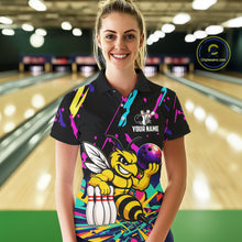 Load image into Gallery viewer, Woman wearing a colorful bowling-themed shirt with a bee graphic in a bowling alley.