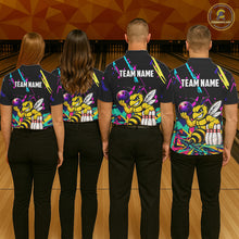 Load image into Gallery viewer, Four people wearing matching shirts with a bee graphic and 'TEAM NAME' text on a bowling alley background.