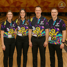 Load image into Gallery viewer, Four people wearing matching bowling-themed shirts with bee graphic in a bowling alley.