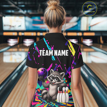 Load image into Gallery viewer, Person wearing a colorful bowling-themed shirt with a raccoon design in a bowling alley.