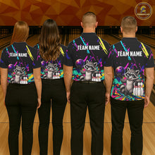 Load image into Gallery viewer, Four people wearing matching shirts with a raccoon graphic and 'TEAM NAME' text on a bowling alley background.