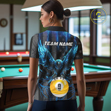 Load image into Gallery viewer, Back view of woman wearing a blue lightning eagle pool team shirt in a billiards hall.