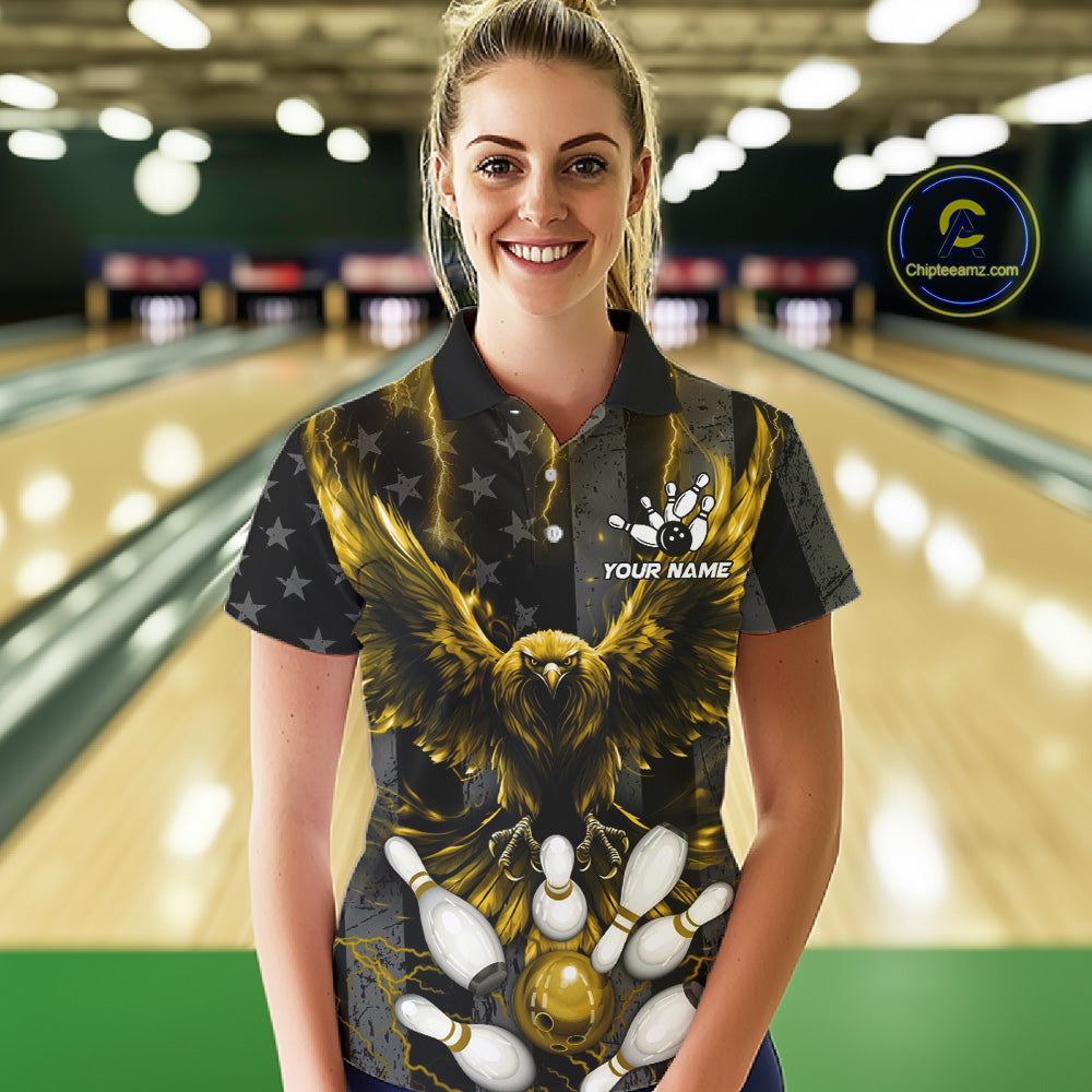 Woman wearing a yellow lightning eagle bowling polo shirt at a bowling alley front view.