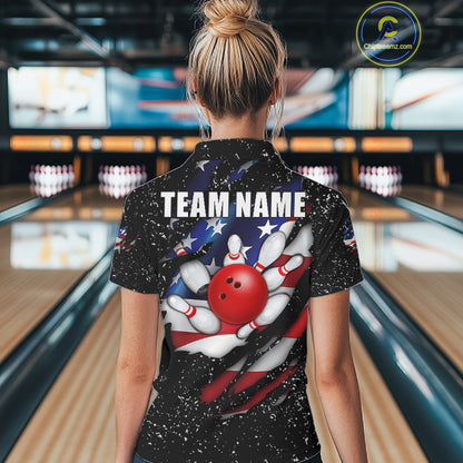 Back view of woman wearing a black grunge American flag eagle bowling polo shirt inside a bowling alley.