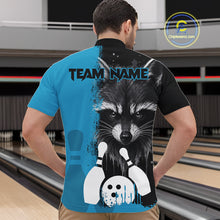 Load image into Gallery viewer, Back view of man wearing a black and blue raccoon bowling quarter zip shirt in a bowling alley.