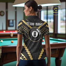 Load image into Gallery viewer, Back view of woman wearing a black and gold 8 ball tribal pool shirt in a billiards hall.