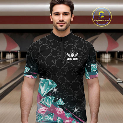 Man wearing a black bowling shirt with diamonds patterns in a bowling alley.