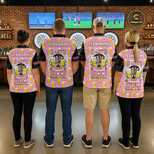 Load image into Gallery viewer, Back view of darts players wearing matching pink and black darts and beer darts shirts.