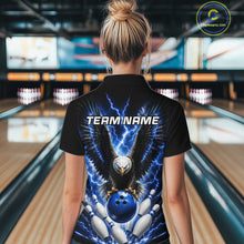 Load image into Gallery viewer, Back view of woman wearing a blue thunder lightning eagle bowling polo shirt inside a bowling alley.