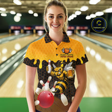 Load image into Gallery viewer, Female model wearing the Black and Yellow Funny Bee Beer Bowling polo shirt with funny bee, beer mug and yellow hexagon graphics, front view