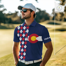 Load image into Gallery viewer, Male golfer wearing Colorado flag golf polo at scenic mountain golf course, perfect for golf vacations, outdoor adventure and state pride.