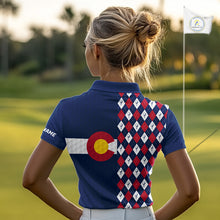 Load image into Gallery viewer, Female golfer wearing Colorado patriotic golf polo at country club, stylish golf apparel for tournaments and mountain golf trips.